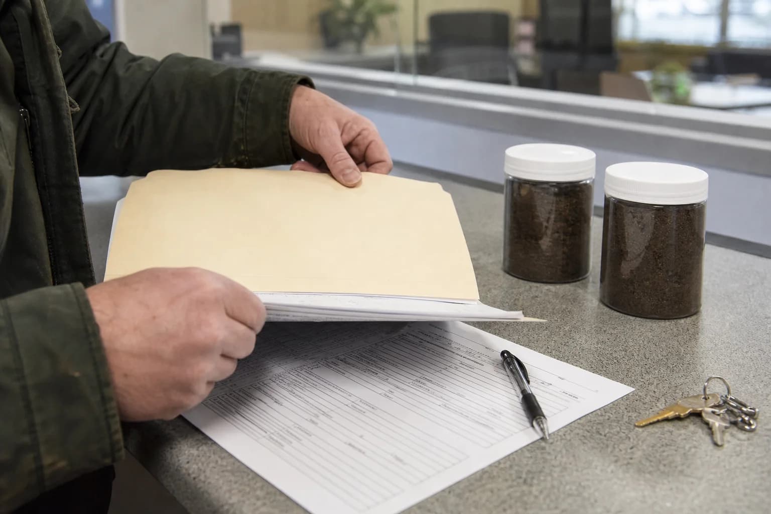 Oregon oil tank permit documents and soil samples at a local compliance counter